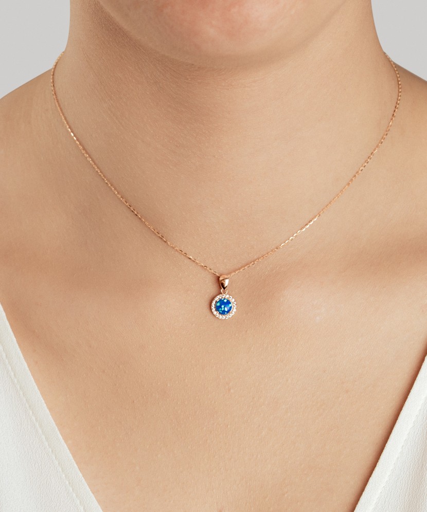 Gold pendant with opal and zircons