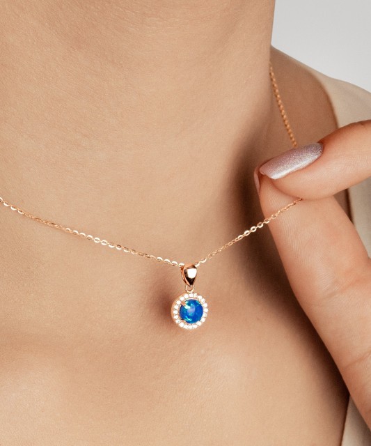 Gold pendant with opal and zircons