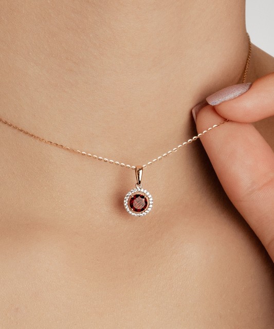 Gold pendant with zircons