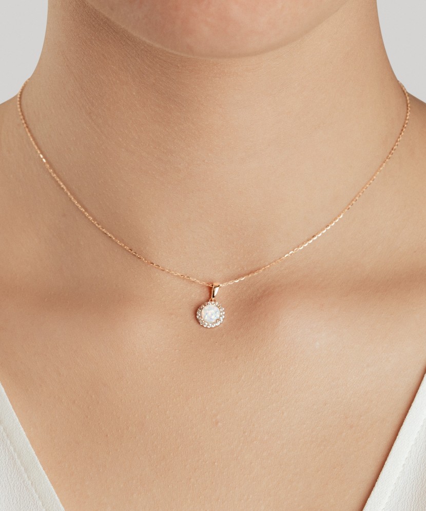 Gold pendant with opal and zircons