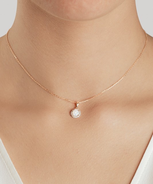 Gold pendant with opal and zircons