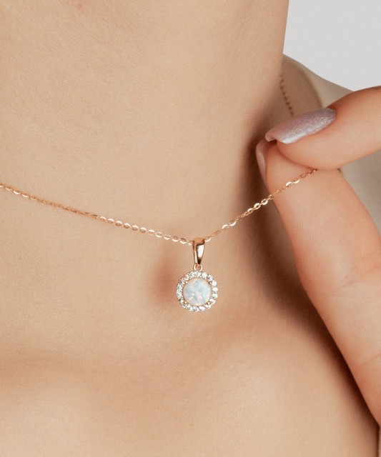 Gold pendant with opal and zircons