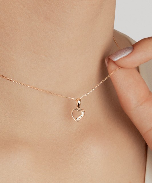 Gold pendant with zircons "heart"