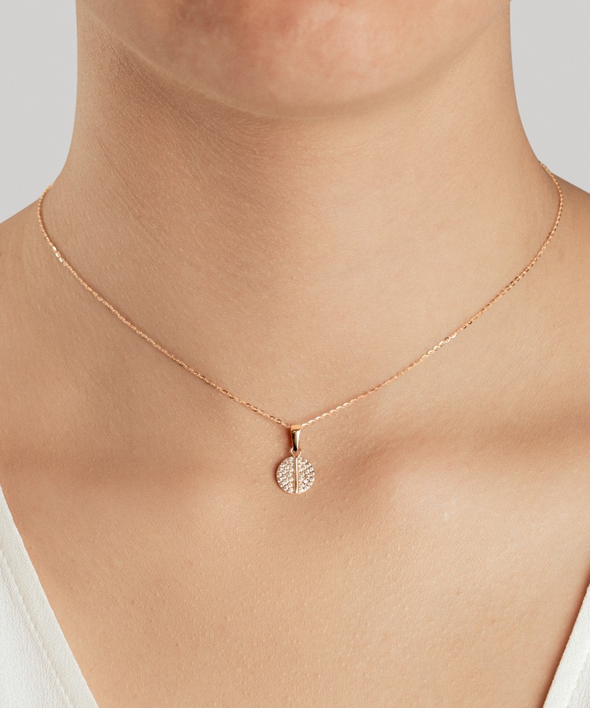 Gold pendant with zircons