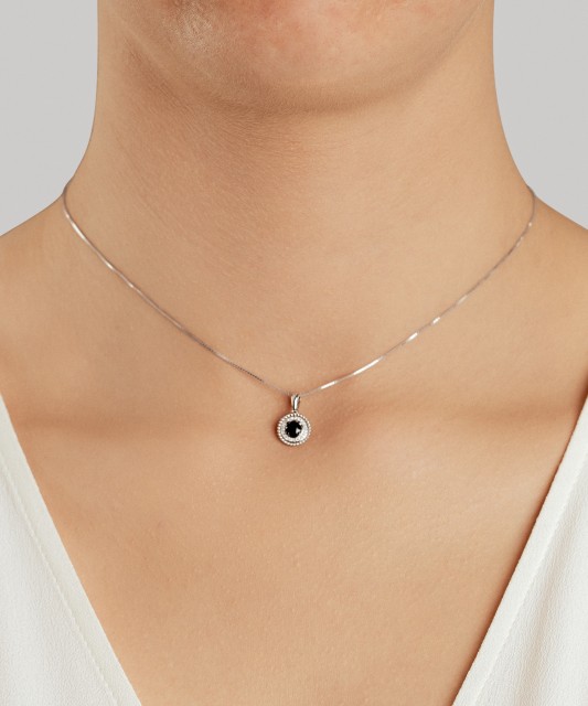 White gold pendant with diamonds and sapphires