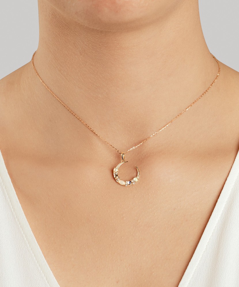 Yellow gold pendant with diamonds, opals and topazes