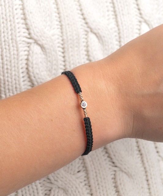 Black string bracelet with gold pendant