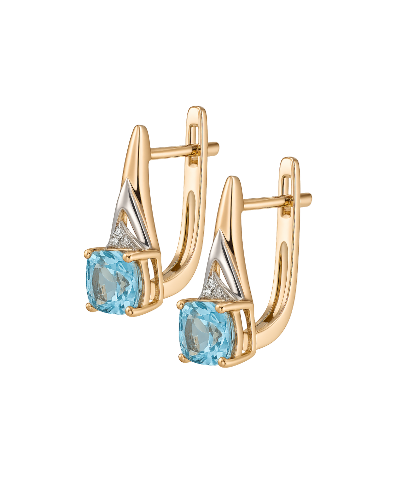 Kultaiset korvakorut topaaseilla ja timanteilla