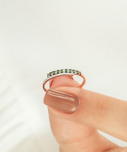 Gold ring with emeralds and diamonds