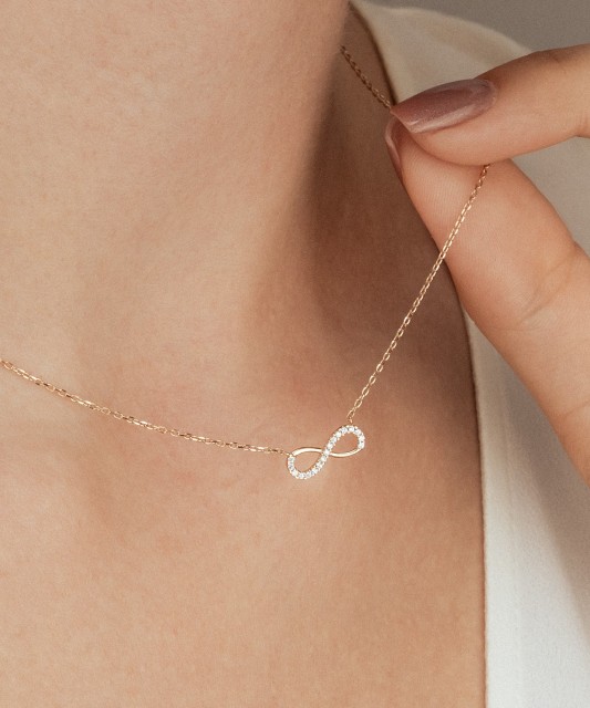 Gold chain with zirconium pendant "infinity"
