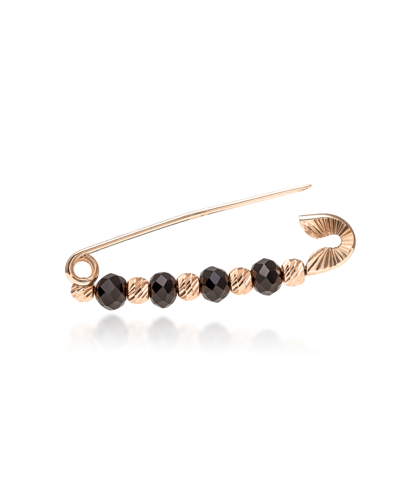 Gold brooch with onyx