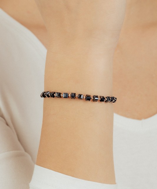 Black string bracelet with gold And Hematites