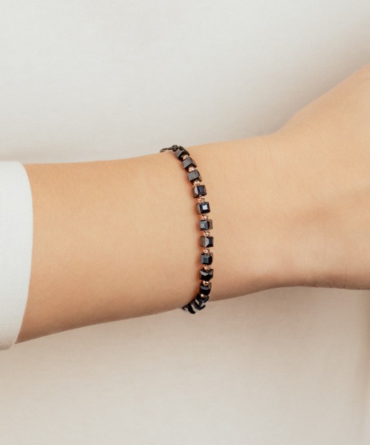 Black string bracelet with gold And Hematites