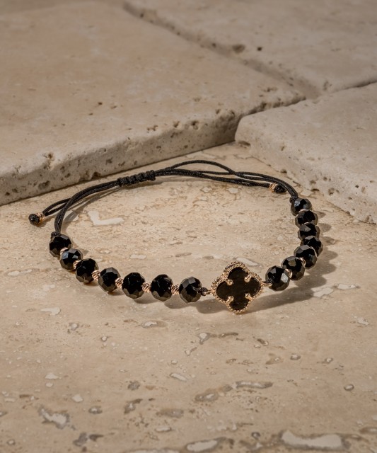 Black string bracelet with gold and onyxes