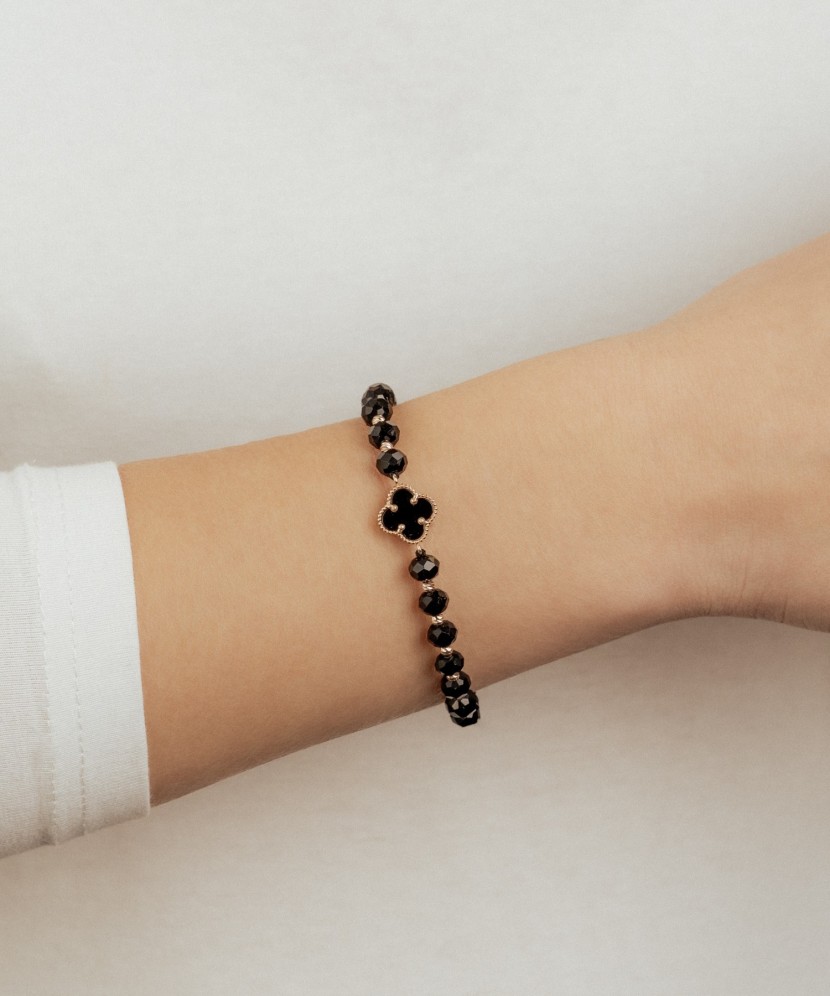 Black string bracelet with gold and onyxes