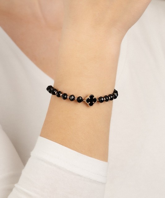 Black string bracelet with gold and onyxes