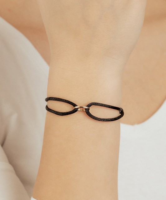 Black string bracelet with gold