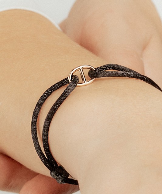 Black string bracelet with gold