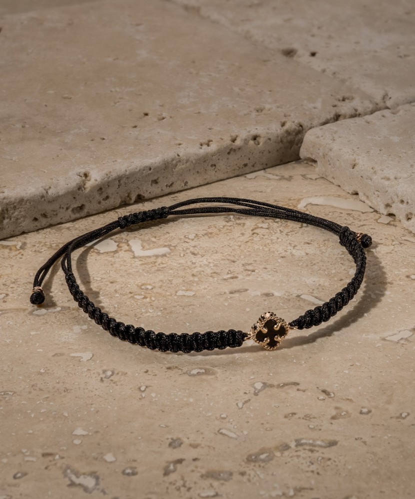 Black string bracelet with gold and onyxes