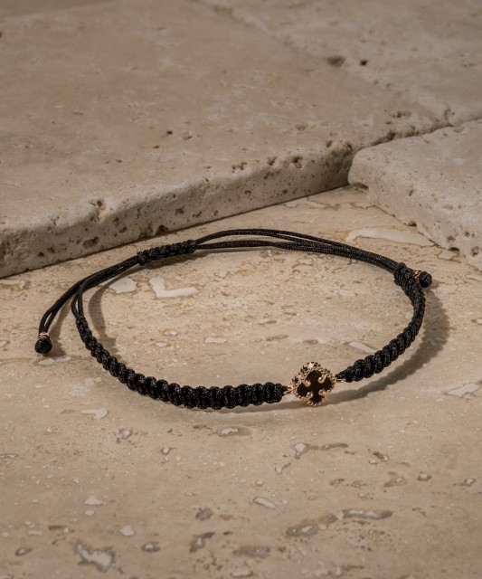 Black string bracelet with gold and onyxes