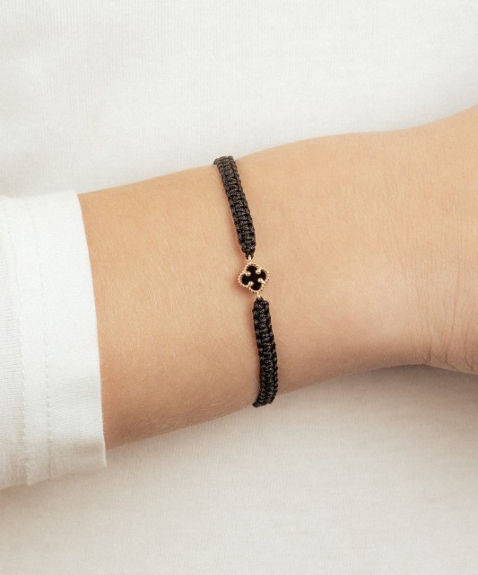 Black string bracelet with gold and onyxes