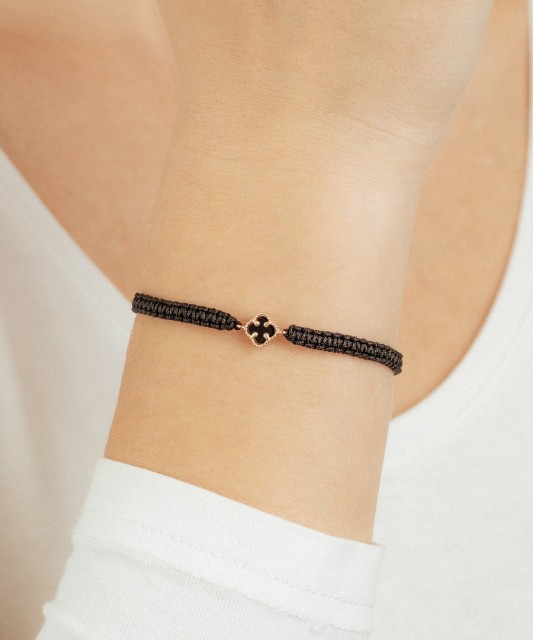 Black string bracelet with gold and onyxes