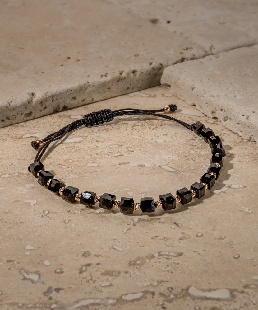 Black string bracelet with gold and onyxes