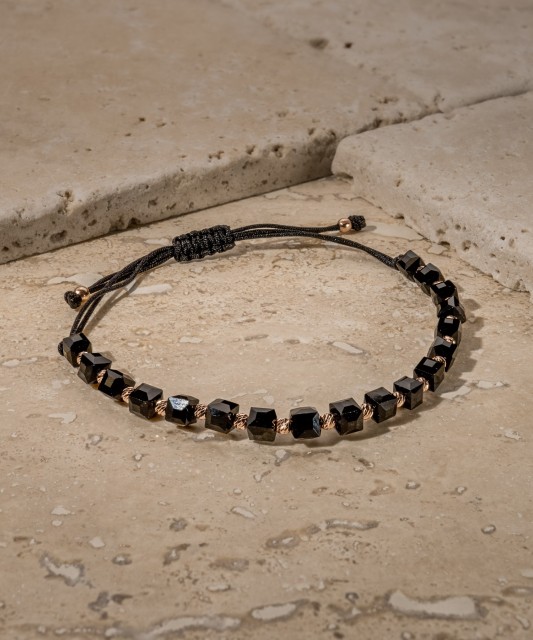 Black string bracelet with gold and onyxes