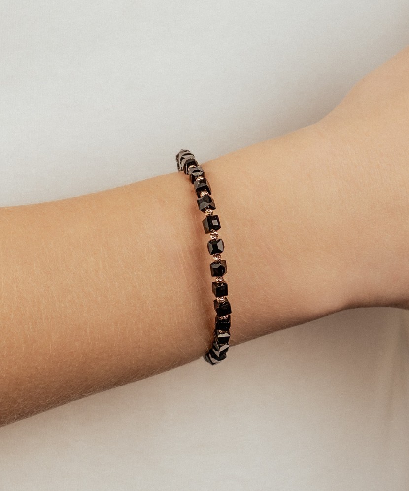 Black string bracelet with gold and onyxes