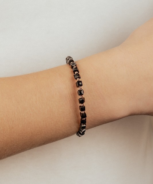 Black string bracelet with gold and onyxes