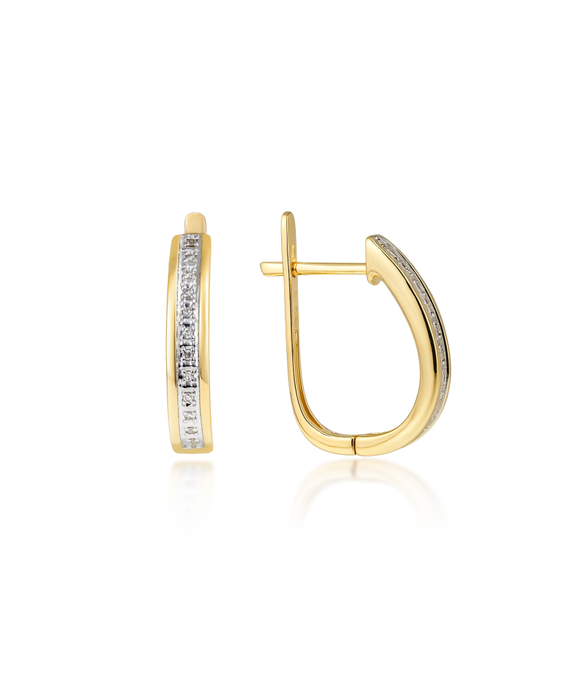 Keltaiset kultaiset korvakorut timanteilla