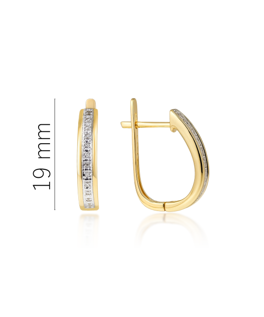 Keltaiset kultaiset korvakorut timanteilla