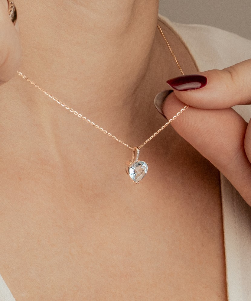 Gold pendant with topaz and zircons