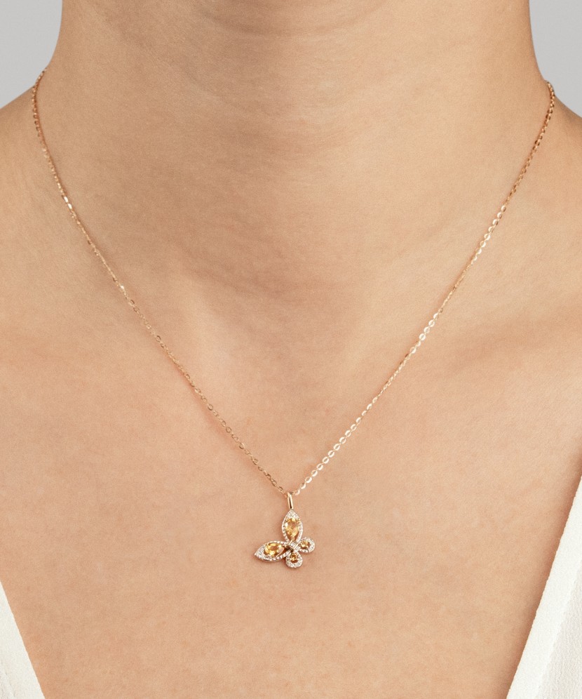 Keltakultainen riipus timanteilla ja sitriineillä