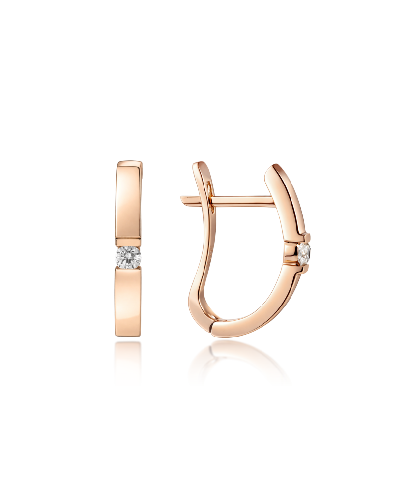 Kultaiset korvakorut timanteilla