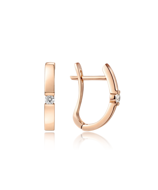 Kultaiset korvakorut timanteilla