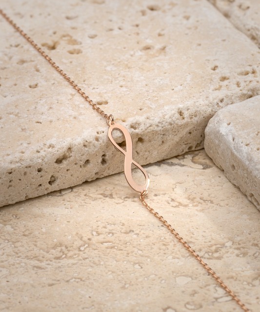 Kultainen rannekoru "ääretön"