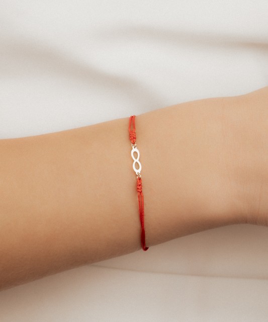 Red string bracelet with gold pendant "Infinity"