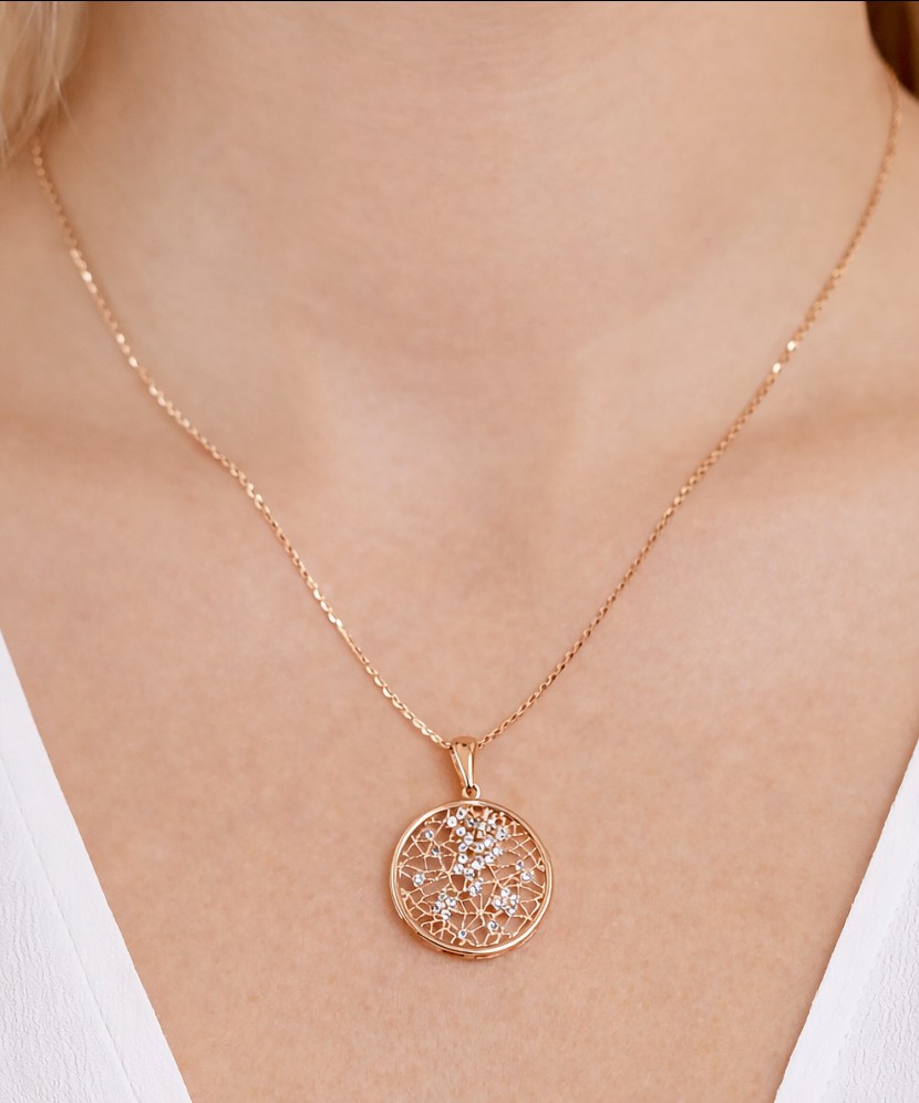Gold pendant with zircons