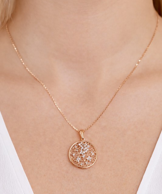 Gold pendant with zircons