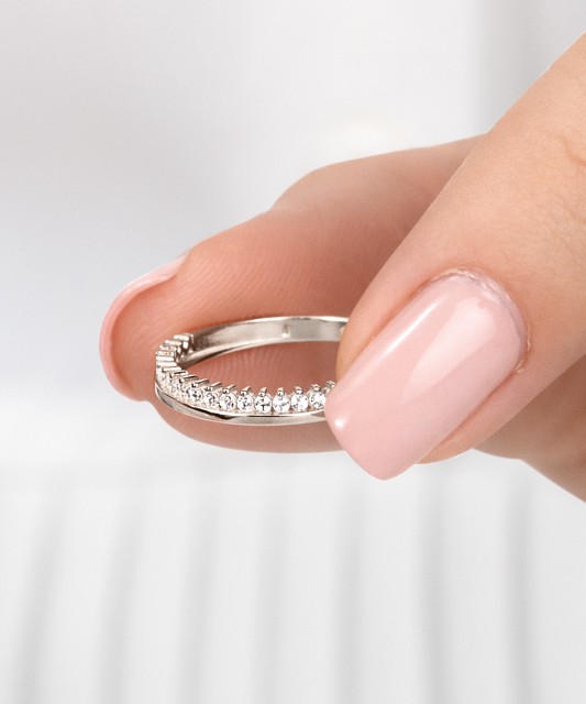 White gold ring with zircons