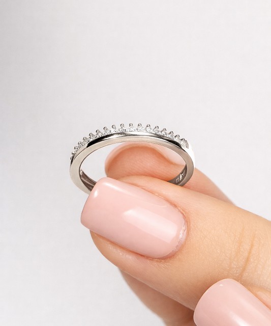 White gold ring with zircons