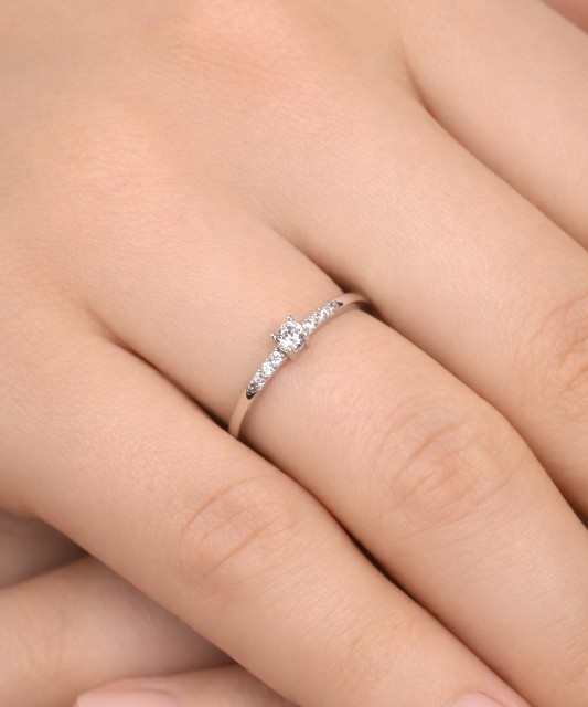 White gold ring with zircons