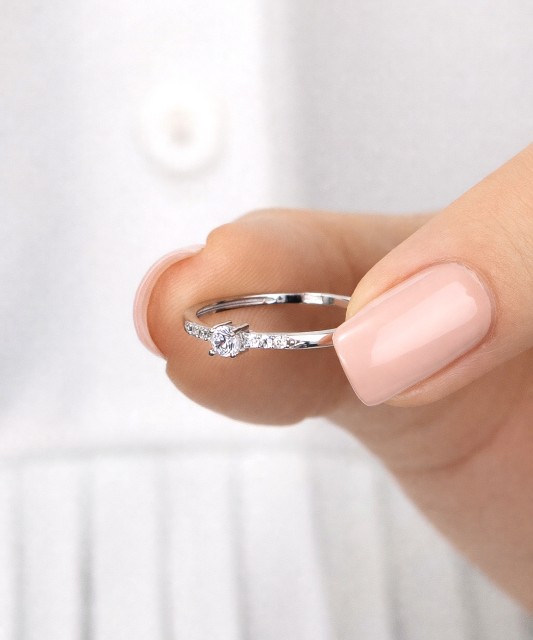 White gold ring with zircons