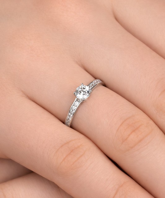 White gold ring with zircons