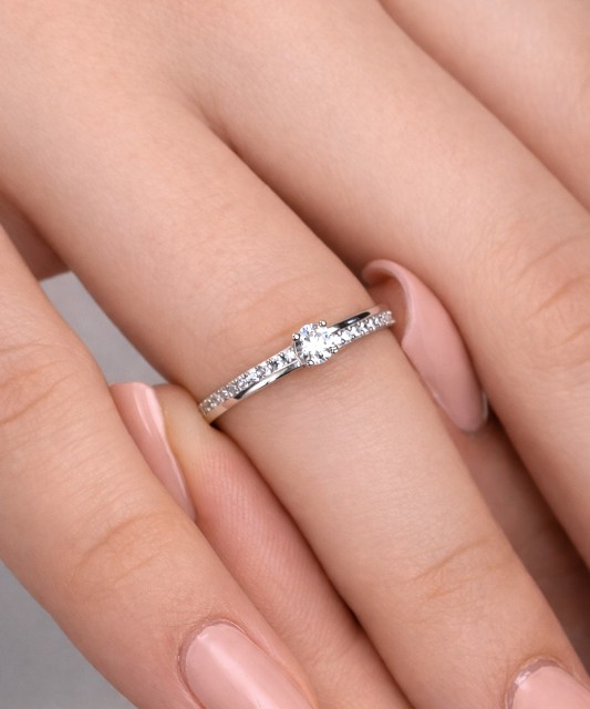 White gold ring with zircons