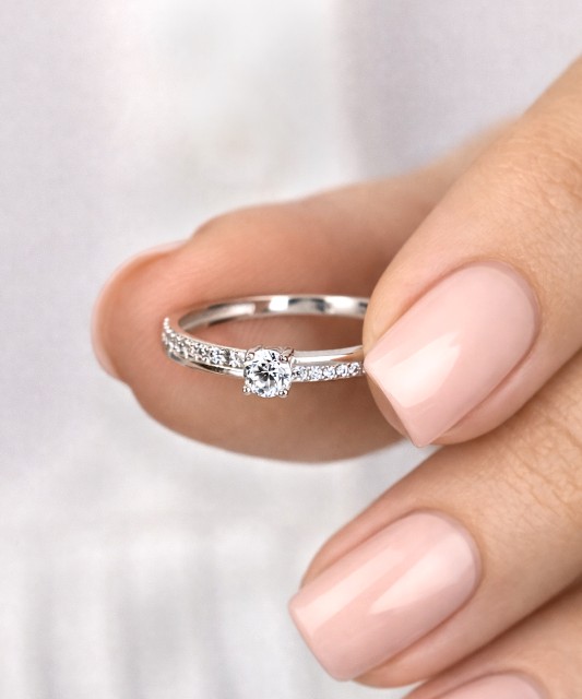 White gold ring with zircons