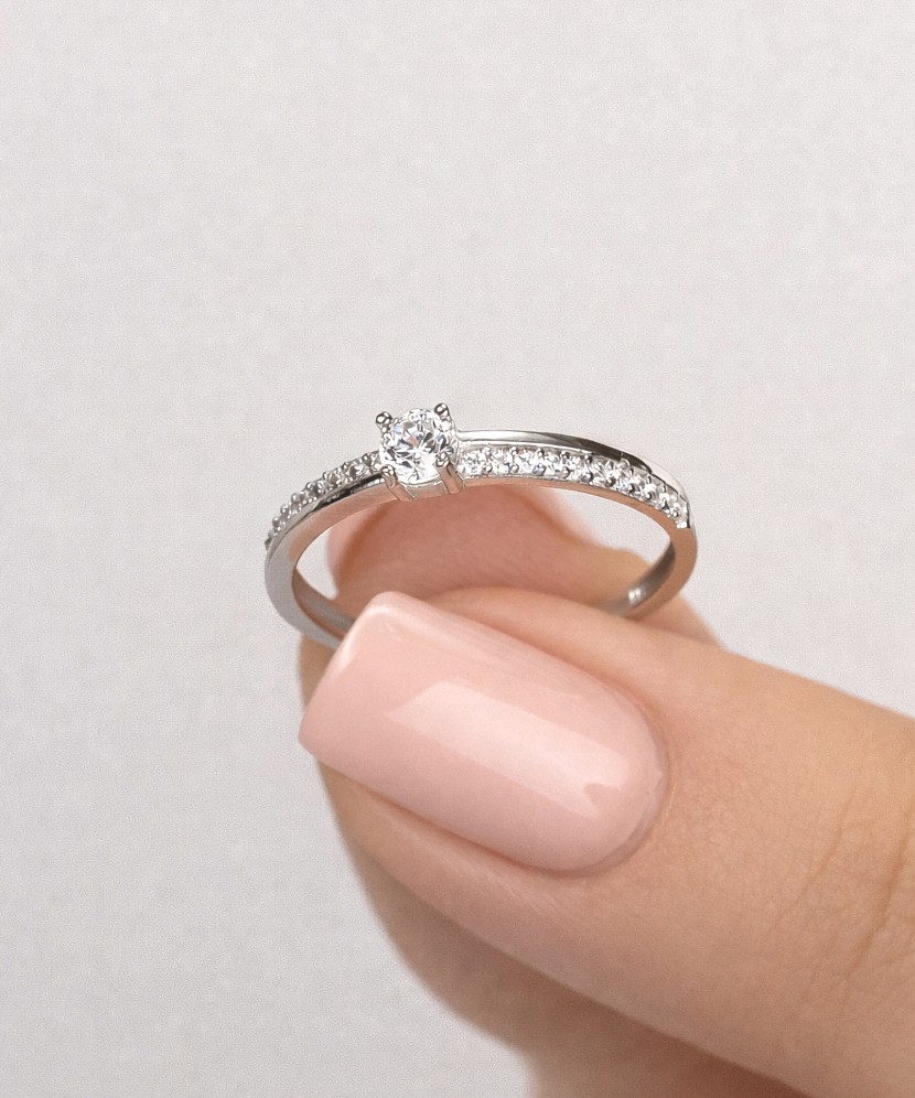 White gold ring with zircons