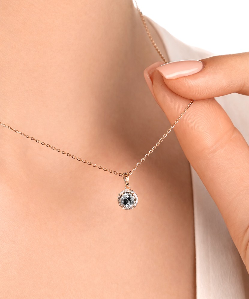 Gold pendant with white topaz and diamonds