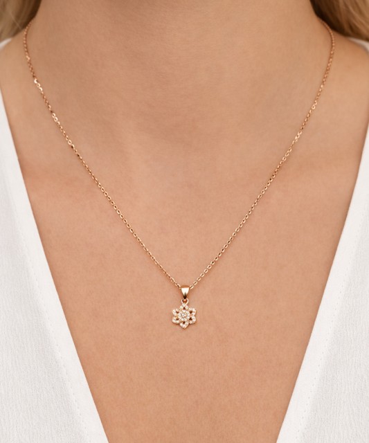 Gold pendant with zircons